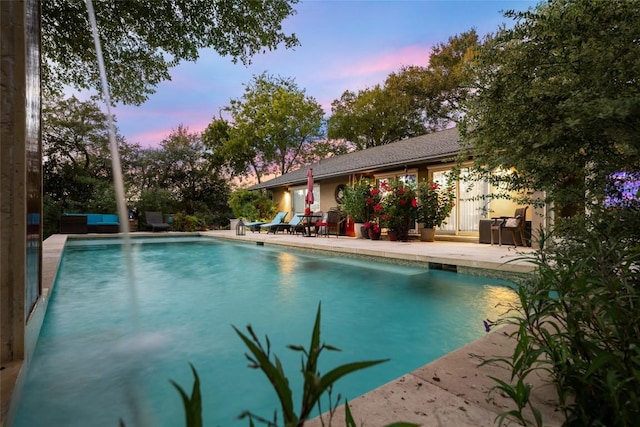4305 Cliffwood Cir, Austin, TX 78759 - pool at dusk featuring an outdoor pool and a patio area