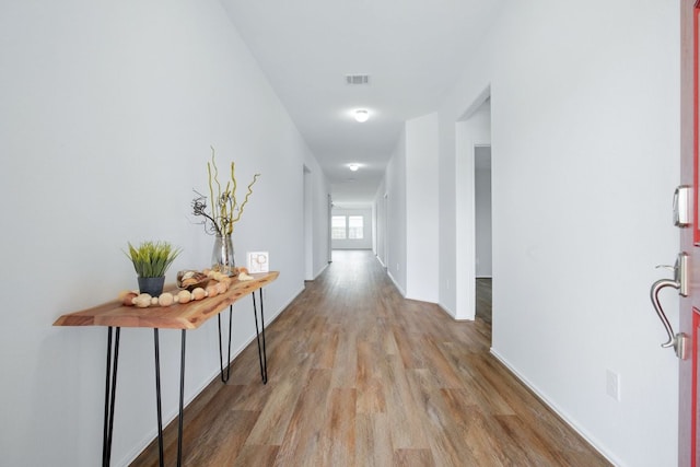 601 Sassafras St, Hutto, TX 78634 - corridor featuring wood finished floors and baseboards