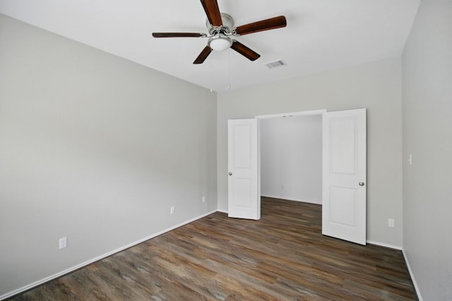 601 Sassafras St, Hutto, TX 78634 - unfurnished bedroom featuring wood finished floors, baseboards, and a ceiling fan