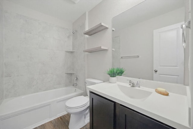 601 Sassafras St, Hutto, TX 78634 - full bathroom with toilet, vanity, wood finished floors, and shower / bath combination