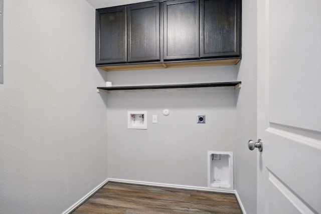601 Sassafras St, Hutto, TX 78634 - laundry area with hookup for an electric dryer, hookup for a washing machine, cabinet space, hookup for a gas dryer, and dark wood-type flooring