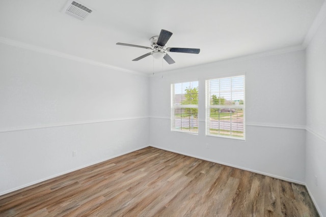 601 Sassafras St, Hutto, TX 78634 - empty room featuring ornamental molding, wood finished floors, and ceiling fan