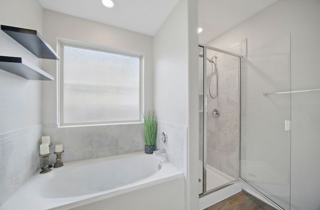 601 Sassafras St, Hutto, TX 78634 - bathroom with a garden tub and a shower stall