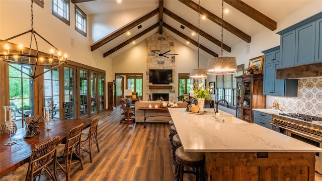 114 Turning Stone Cir, Fredericksburg, TX 78624 - kitchen featuring a sink, high vaulted ceiling, a chandelier, double oven range, and beamed ceiling