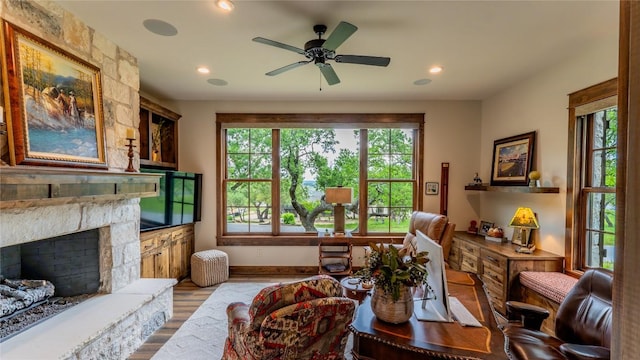 114 Turning Stone Cir, Fredericksburg, TX 78624 - living area with wood finished floors, recessed lighting, a fireplace, a ceiling fan, and baseboards