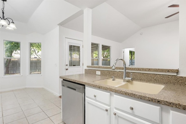 223 Keystone Loop, Kyle, TX 78640 - kitchen featuring dishwasher, lofted ceiling, light stone countertops, white cabinets, and healthy amount of natural light