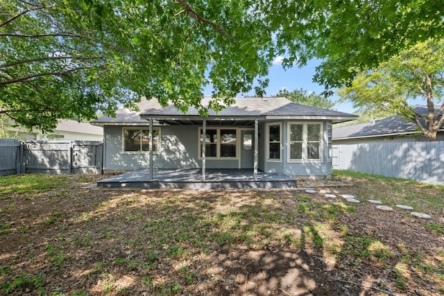 223 Keystone Loop, Kyle, TX 78640 - back of property featuring a fenced backyard and stucco siding