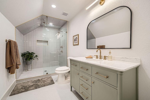 3610 Quiette Dr, Austin, TX 78754 - bathroom featuring vanity, toilet, a shower stall, lofted ceiling, and recessed lighting