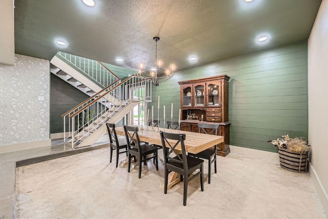 3610 Quiette Dr, Austin, TX 78754 - dining area featuring a chandelier, stairs, recessed lighting, concrete flooring, and baseboards