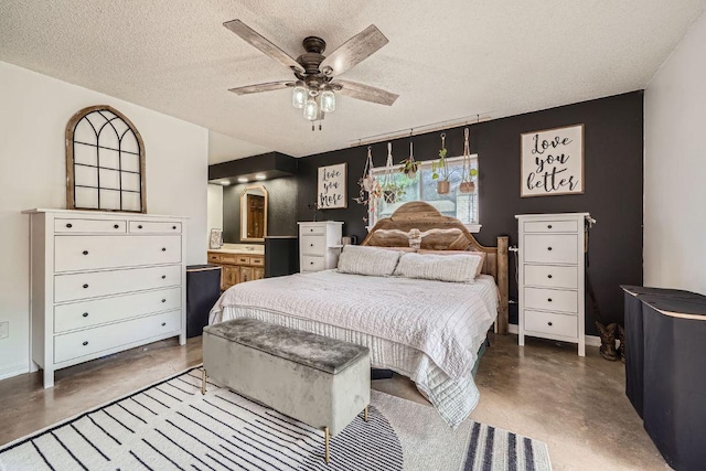3610 Quiette Dr, Austin, TX 78754 - bedroom featuring finished concrete floors, a textured ceiling, and baseboards