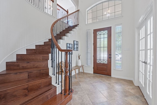 16413 Broadbay Dr, Austin, TX 78717 - entryway with healthy amount of natural light, stairs, baseboards, and a high ceiling