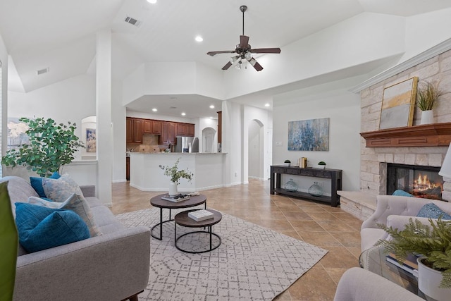16413 Broadbay Dr, Austin, TX 78717 - living area with ceiling fan, arched walkways, light tile patterned floors, a stone fireplace, and recessed lighting