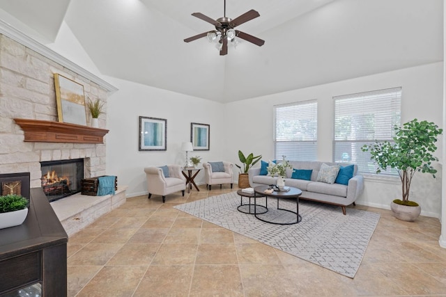 16413 Broadbay Dr, Austin, TX 78717 - living room with high vaulted ceiling, a ceiling fan, baseboards, a fireplace, and stone finish floors