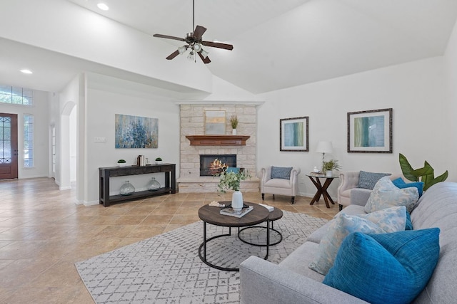 16413 Broadbay Dr, Austin, TX 78717 - living area with arched walkways, ceiling fan, a stone fireplace, high vaulted ceiling, and recessed lighting