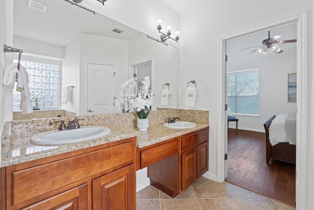 16413 Broadbay Dr, Austin, TX 78717 - ensuite bathroom featuring double vanity, a ceiling fan, and baseboards