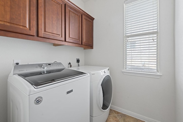 16413 Broadbay Dr, Austin, TX 78717 - washroom with washer and clothes dryer, cabinet space, baseboards, and light tile patterned floors
