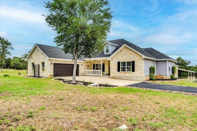 1033 Castleway Rd, New Braunfels, TX 78132 - view of front of property with stone siding, driveway, a garage, and a front yard