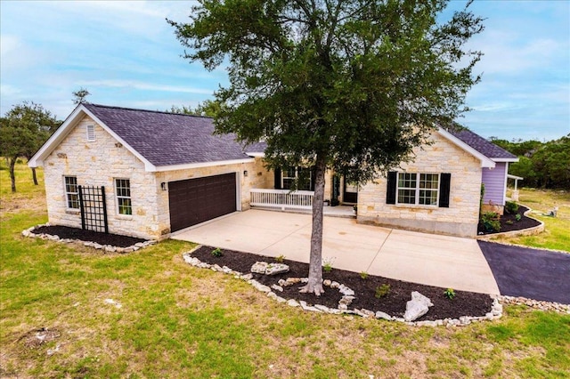 1033 Castleway Rd, New Braunfels, TX 78132 - view of front of home with stone siding, an attached garage, driveway, a front lawn, and covered porch