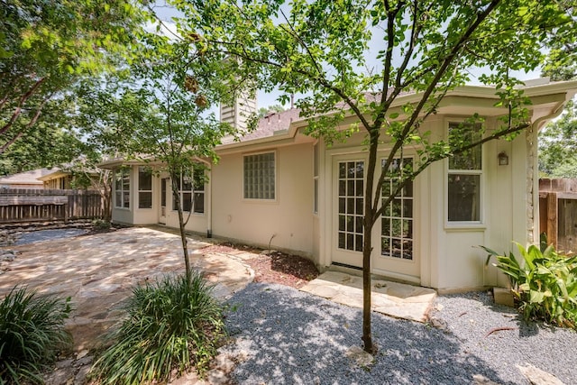 4200 Great Plains Dr, Austin, TX 78735 - back of house with a patio area and a chimney