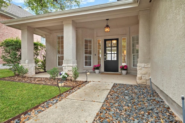 11817 Lake Stone Dr, Austin, TX 78738 - property entrance with a porch and stucco siding