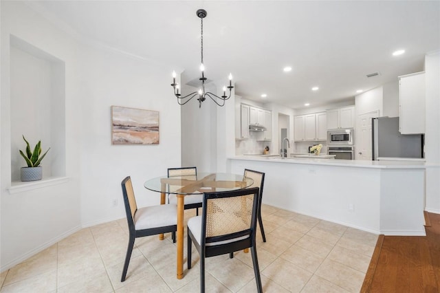 11817 Lake Stone Dr, Austin, TX 78738 - dining space with a chandelier, recessed lighting, light tile patterned floors, and baseboards