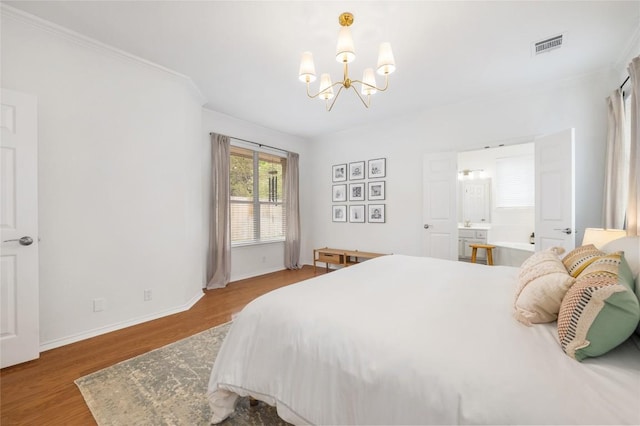 11817 Lake Stone Dr, Austin, TX 78738 - bedroom featuring a chandelier, wood finished floors, and baseboards