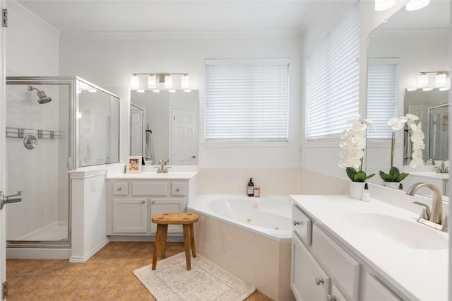 11817 Lake Stone Dr, Austin, TX 78738 - bathroom with a stall shower, two vanities, a tub with jets, and crown molding