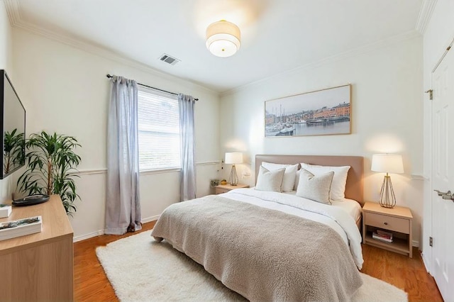11817 Lake Stone Dr, Austin, TX 78738 - bedroom with crown molding, light wood-style floors, and baseboards