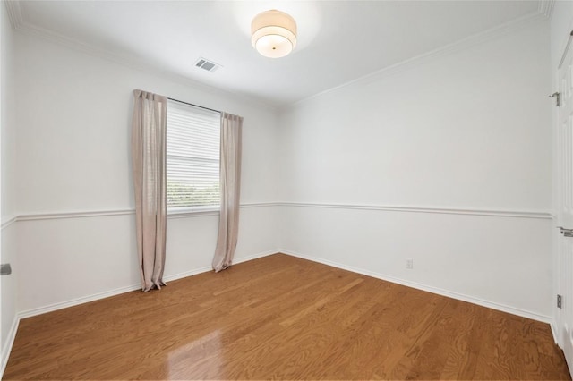 11817 Lake Stone Dr, Austin, TX 78738 - spare room with wood finished floors, baseboards, and crown molding