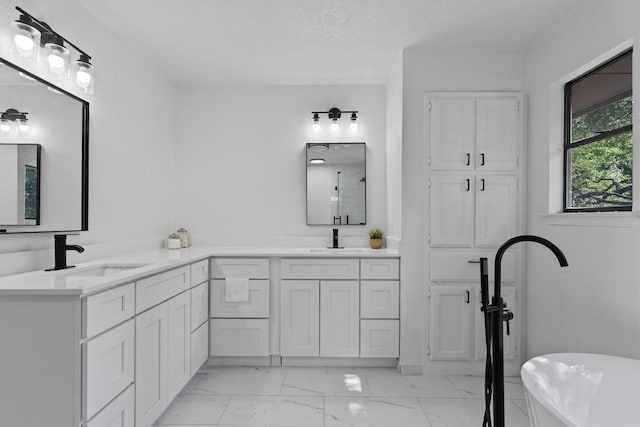 7915 Petaca Trl, Austin, TX 78729 - full bath featuring marble look tiles, double vanity, and a freestanding bath