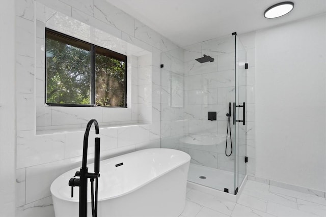 7915 Petaca Trl, Austin, TX 78729 - full bathroom featuring a marble finish shower, marble look tile flooring, and a soaking tub