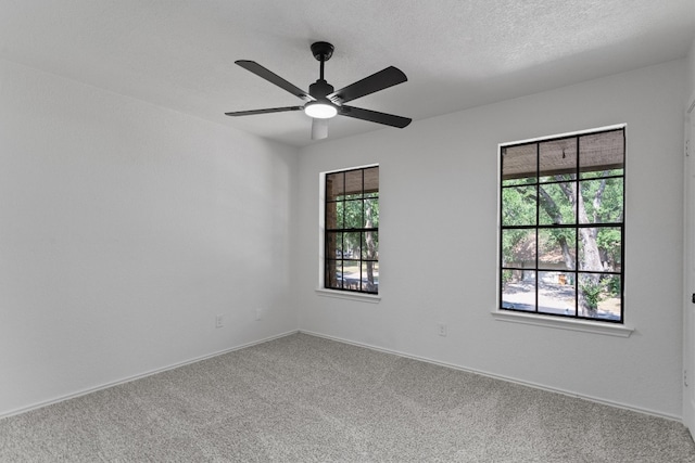 7915 Petaca Trl, Austin, TX 78729 - empty room featuring carpet floors, a ceiling fan, and baseboards