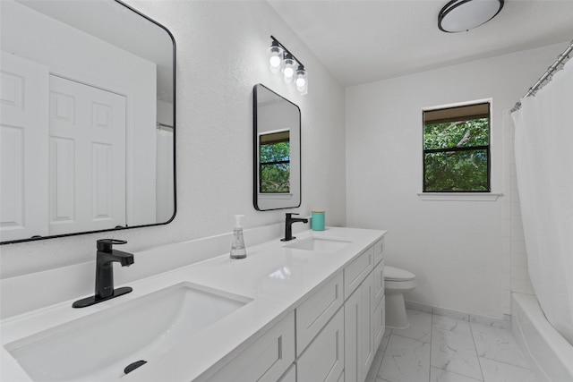 7915 Petaca Trl, Austin, TX 78729 - full bathroom with marble finish flooring, double vanity, toilet, shower / tub combo, and baseboards
