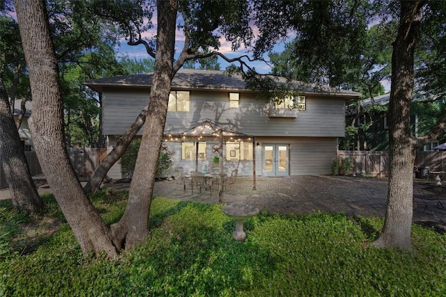 7915 Petaca Trl, Austin, TX 78729 - back of property featuring french doors and a patio