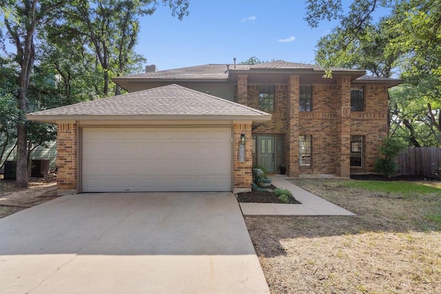 7915 Petaca Trl, Austin, TX 78729 - view of front facade with brick siding, an attached garage, and concrete driveway