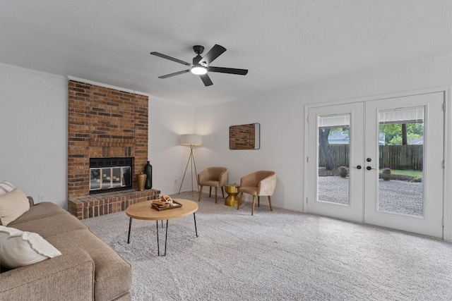7915 Petaca Trl, Austin, TX 78729 - living room featuring french doors, carpet flooring, a brick fireplace, and ceiling fan