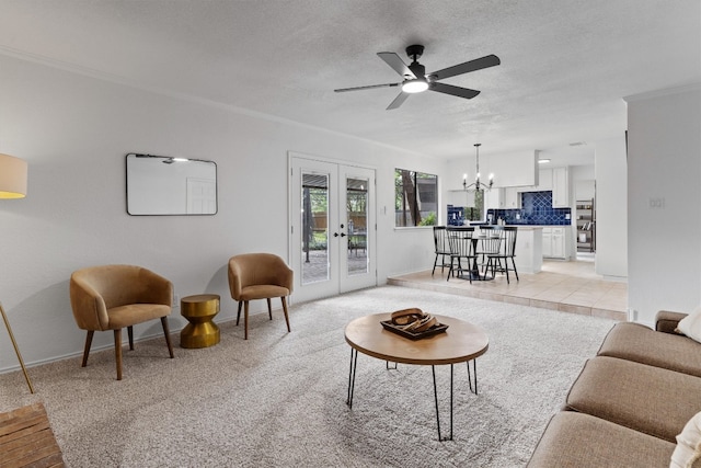 7915 Petaca Trl, Austin, TX 78729 - living room featuring a chandelier, ceiling fan, baseboards, french doors, and a textured ceiling