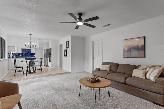 7915 Petaca Trl, Austin, TX 78729 - living area featuring a chandelier, a ceiling fan, a textured ceiling, and baseboards