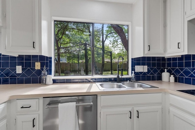 7915 Petaca Trl, Austin, TX 78729 - kitchen with dishwasher, a sink, white cabinets, light countertops, and decorative backsplash