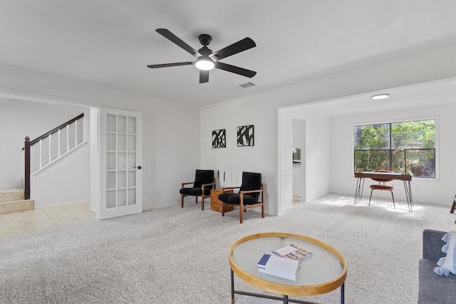7915 Petaca Trl, Austin, TX 78729 - sitting room featuring carpet flooring, stairway, a ceiling fan, baseboards, and french doors