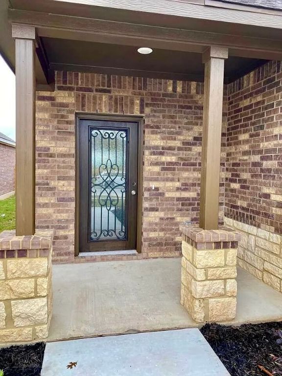11713 Caithness Way, Austin, TX 78754 - view of exterior entry featuring brick siding