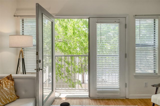 2502 Leon St Unit 208, Austin, TX 78705 - doorway to outside featuring wood finished floors and baseboards
