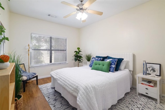 2502 Leon St Unit 208, Austin, TX 78705 - bedroom with baseboards, light wood-style flooring, and a ceiling fan