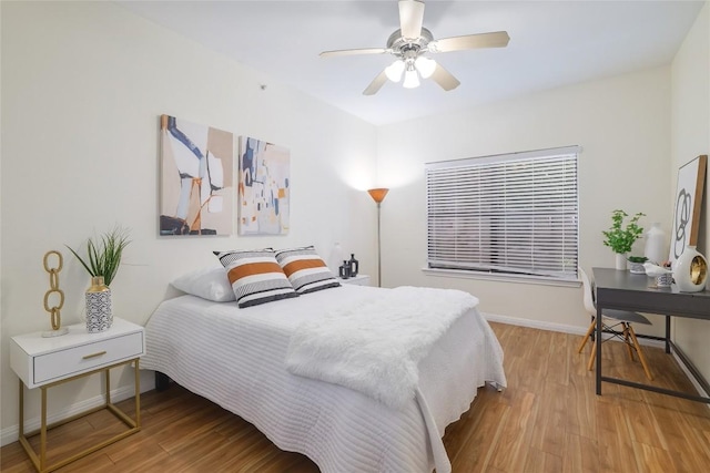 2502 Leon St Unit 208, Austin, TX 78705 - bedroom featuring wood finished floors, baseboards, and ceiling fan