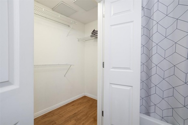 2502 Leon St Unit 208, Austin, TX 78705 - walk in closet with attic access and wood finished floors