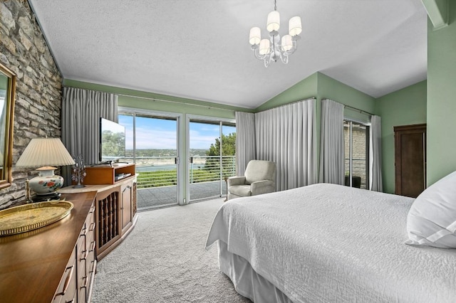 717 Mariner, Lakeway, TX 78734 - bedroom featuring lofted ceiling, access to outside, carpet, a chandelier, and a textured ceiling