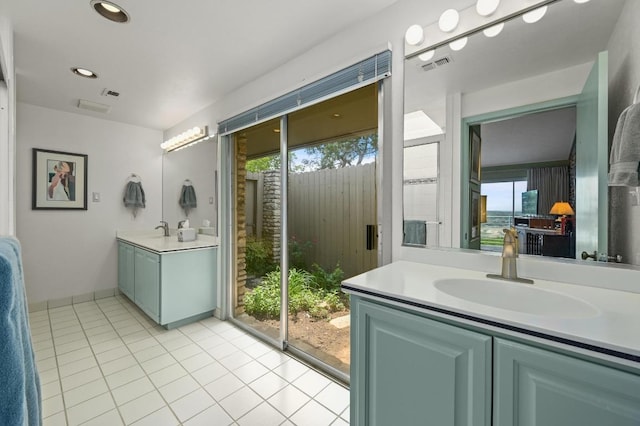 717 Mariner, Lakeway, TX 78734 - bathroom featuring tile patterned flooring, vanity, and recessed lighting