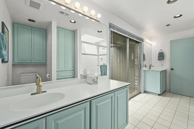 717 Mariner, Lakeway, TX 78734 - full bath with tile patterned flooring, vanity, a stall shower, and recessed lighting