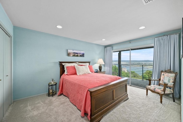 717 Mariner, Lakeway, TX 78734 - bedroom with a water view, light carpet, recessed lighting, baseboards, and access to exterior