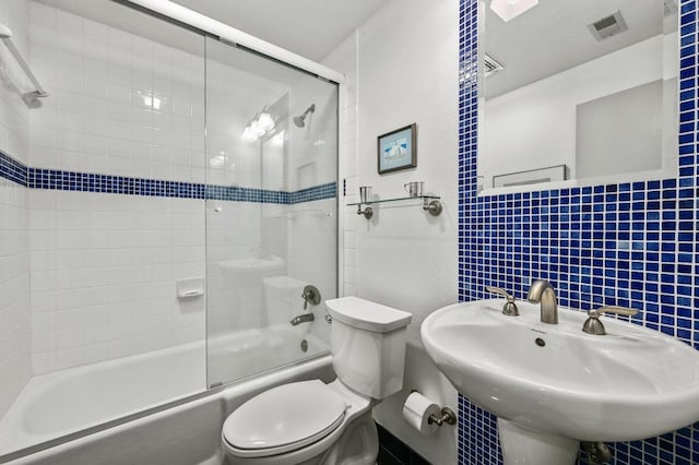 717 Mariner, Lakeway, TX 78734 - full bathroom featuring toilet, combined bath / shower with glass door, and a sink